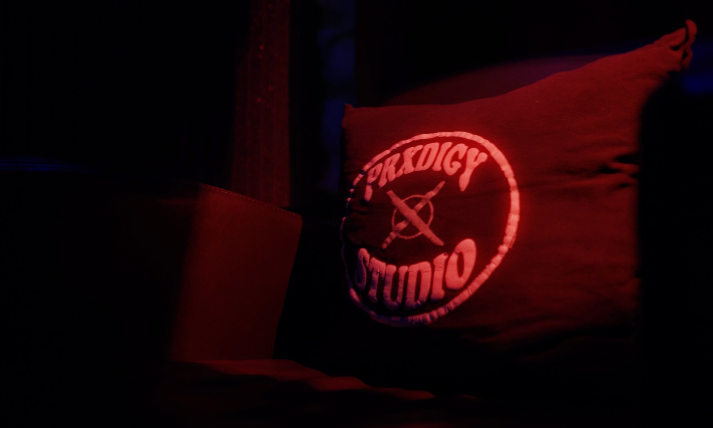 PRXDIGY STUDIO logo on wall